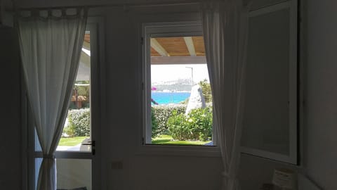 The second master bedroom "Mirto" has a stunning sea view & private entrance