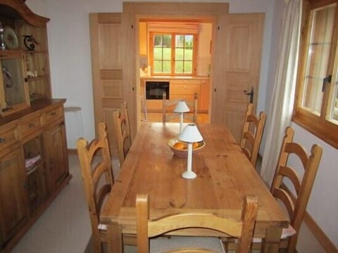 Dining room leading to kitchen with plenty of natural light