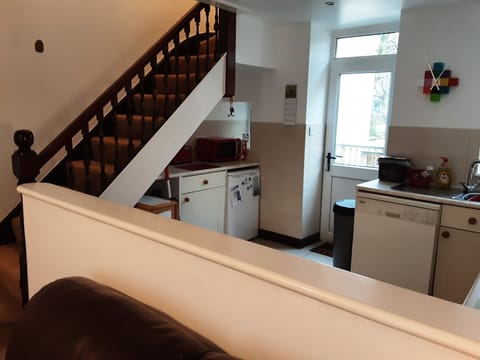 Kitchen with access to riverside terrace