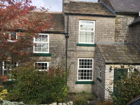 Front view. Smithy Cottage consists of the green door & the six white windows