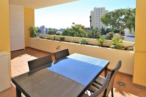 South facing balcony with outdoor dining area and sea views
