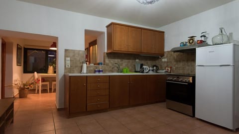 Fully equipped kitchen with separate dining area.
