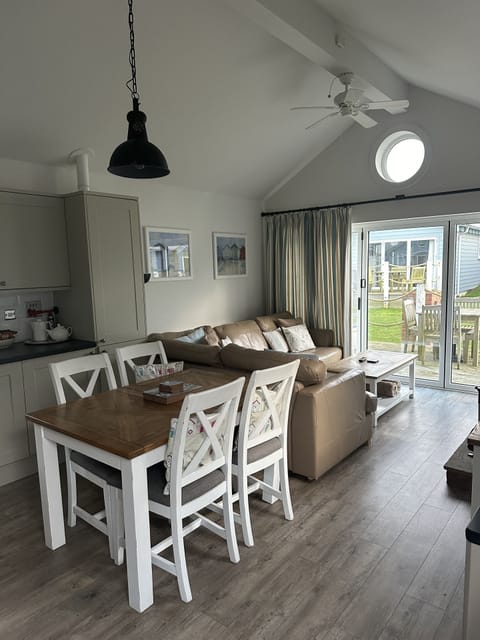 Extending dining table seating for 5 with high chair available