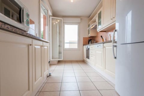 Kitchen from the hall, terrace doors open on the left
