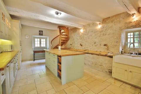 Winter kitchen with AGA, American fridge/freezer, dishwasher. Stairs to TV room.