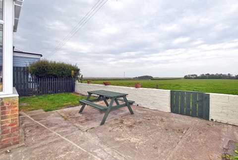 Rear terrace with views over fields