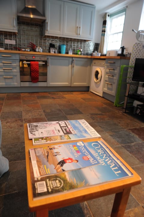 The kitchen diner, with the  most up to date Cornwall Today and Cornwall Life