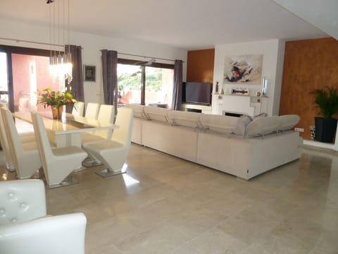 main living area. 55" curved smart tv / DVD / surround sound King size sofa bed