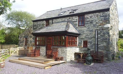 Conservatory with outdoor seating and chimney fire.