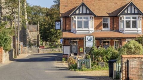 Ship inn. Across the road. Good food and beer