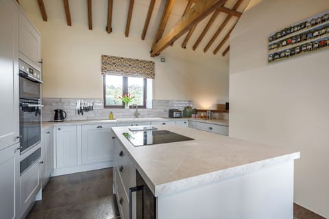 Kitchen with integrated fridge freezer and bottle fridge.  