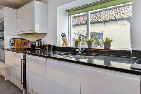 Kitchen:  fridge, double oven, microwave, gas hob, dishwasher, toaster, kettle