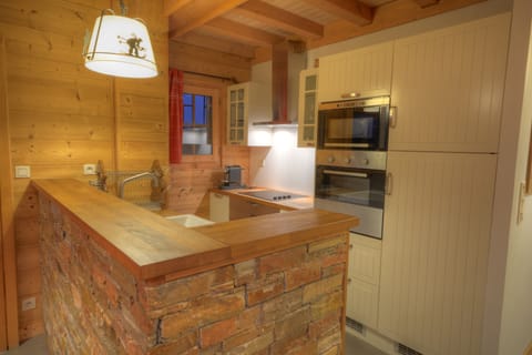 1 of the 2 kitchen wih each a dishwasher, oven, microwave, cooking place, sink