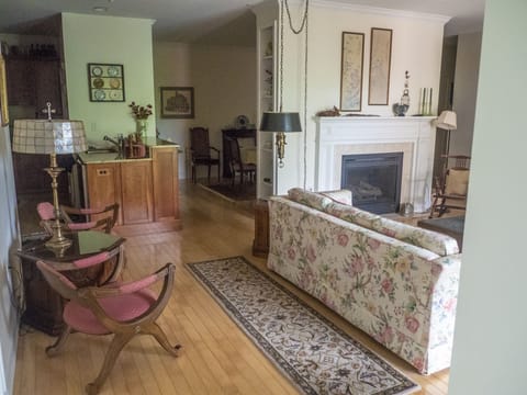 Living room, kitchen counter, and dining room from entrance hall