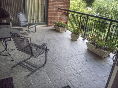 Outside porch with flowers and grill