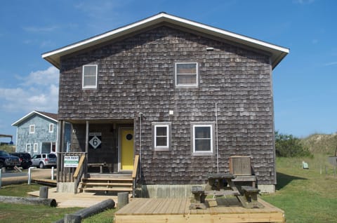 Front of house with grill and picnic table
