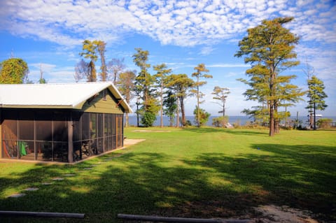 View of the house and the bay from the Little House by the Bay driveway