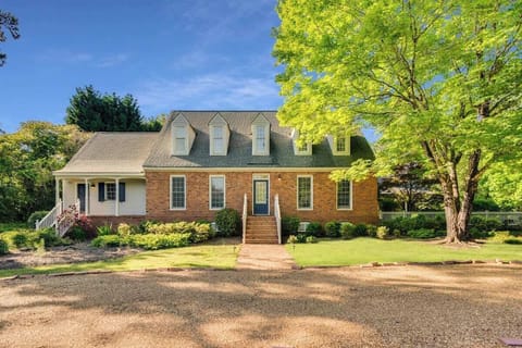 Our stunning front yard with beautiful flowers and manicured lawns is the perfect spot to relax and enjoy the beauty of nature.