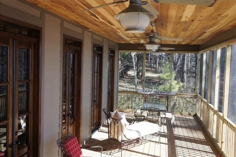 The huge back porch provides screened in comfort -- 12 ft X 39 ft.