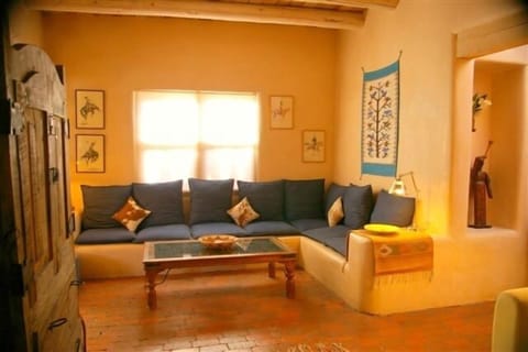 Cuddle up with a good book or a glass of wine on the living room 'bancos.'