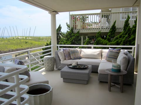 Covered Deck outside of Master Bedroom has a comfortable couch