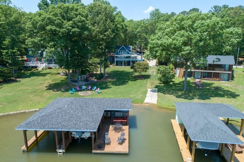 Aerial view of the dock, yard, and fire pit.