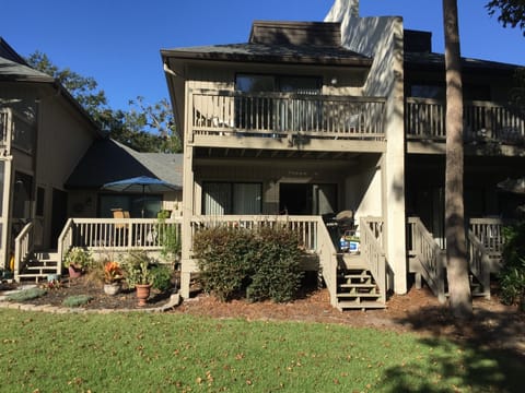 Back covered deck and master bedroom balcony shown here
