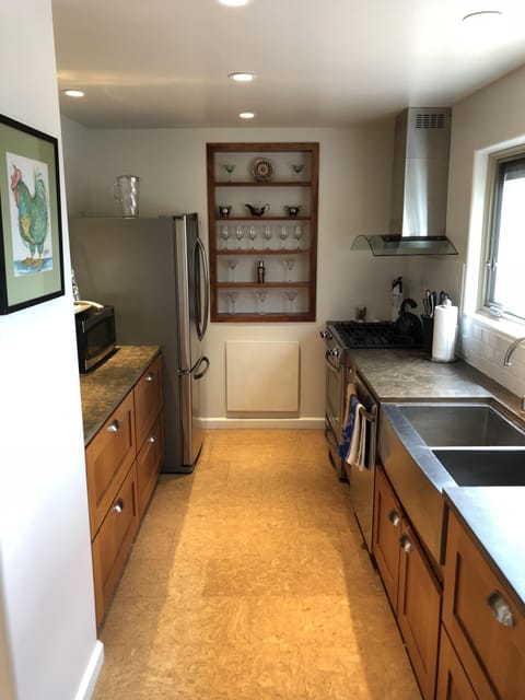 galley kitchen with updated cookware