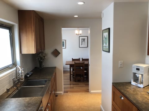 galley kitchen with updated cookware