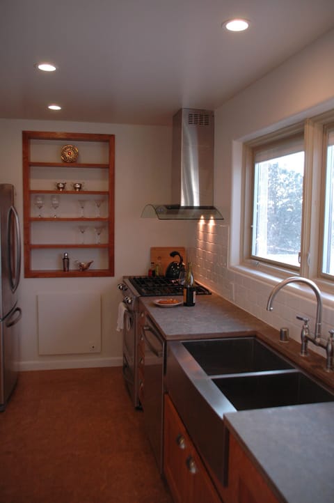 galley kitchen with updated cookware