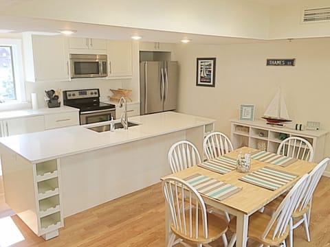 Newly renovated kitchen with stainless steel appliances and views of St. Mary's.