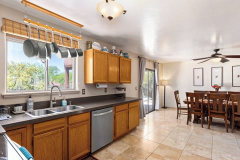 Spacious open plan kitchen a dining area overlooking the pool