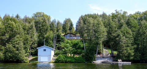 A view of the cottage and dock from out on the lake.