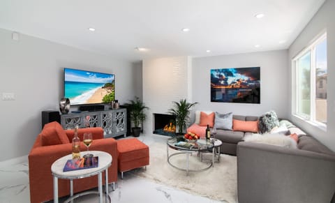 Bright open living room with fireplace and space for your whole group