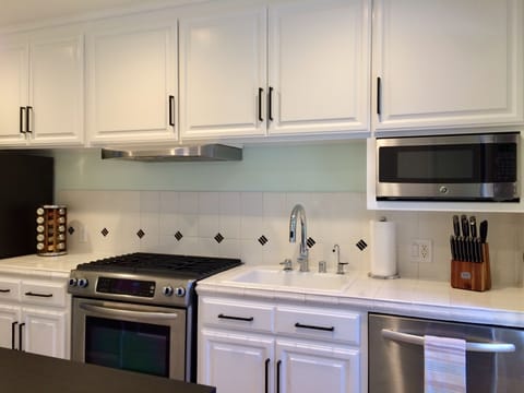 Kitchen with stainless steel appliances.
