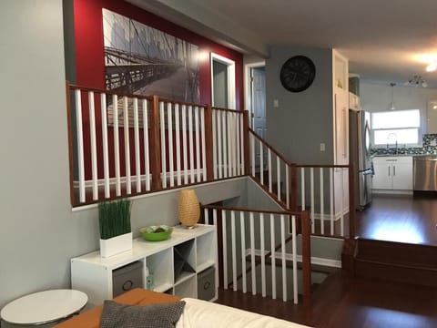 Living room view to kitchen and stairs