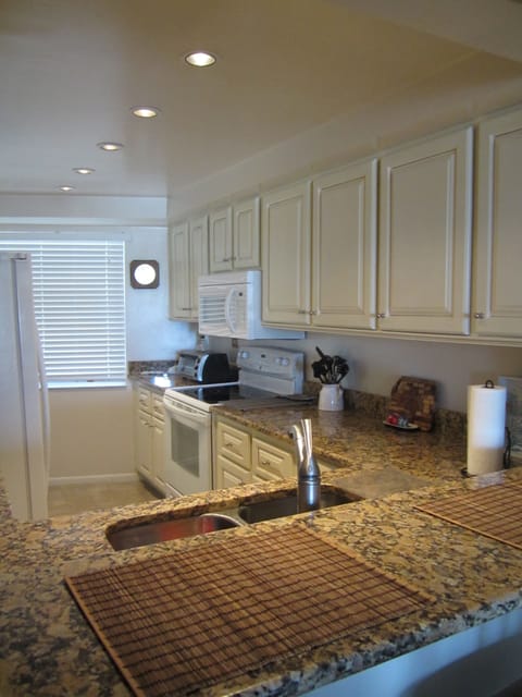 Remodeled kitchen with new countertops and cabinets.