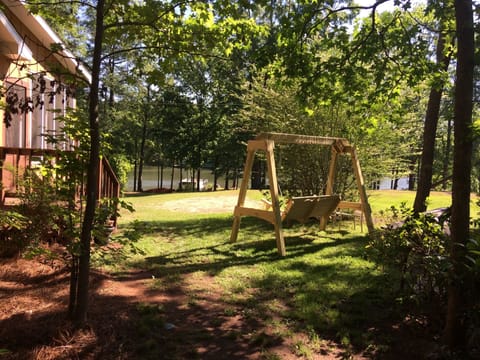Relax in the Swing in the shady side yard and enjoy the lake view