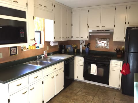 Kitchen with dishwasher, microwave, and washer/dryer