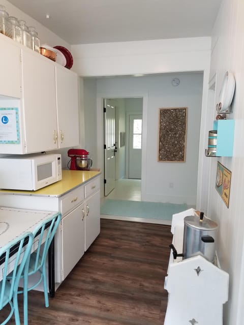  Besides the coffee maker, there's a coffee urn, a microwave, a blender, a mixer