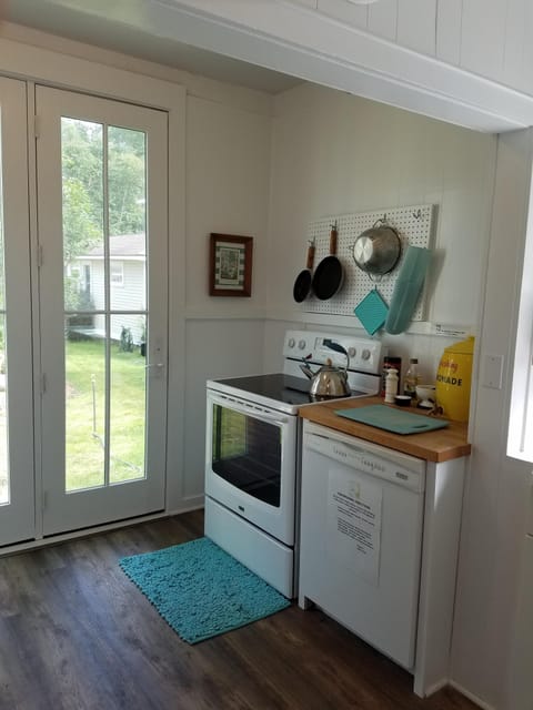 Downstairs kitchen has newer appliances and is equipped with a dishwasher.