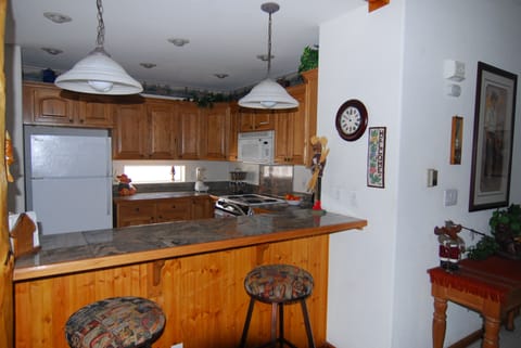 Spacious kitchen, breakfast bar, space to enjoy and not on top of each other. 