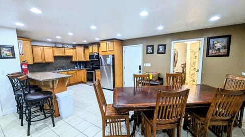 Kitchen and dining area with side laundry room with extra full bath.