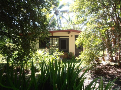 The Honey House is a bungalow in a tropical garden