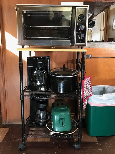 Coffee pot, crockpot, toaster, and toaster ovens.  Full size fridge too!