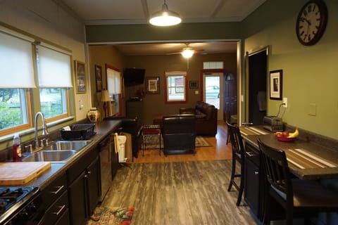 Open concept with kitchen leading to living area