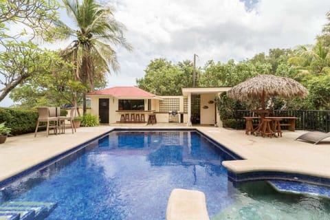 Pool area with Beachfront kitchen, Tiki bar and Barbecue  grill 