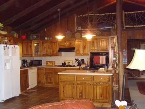 Open Kitchen area with Mountain Laurel hand made banister at Overlooking Loft