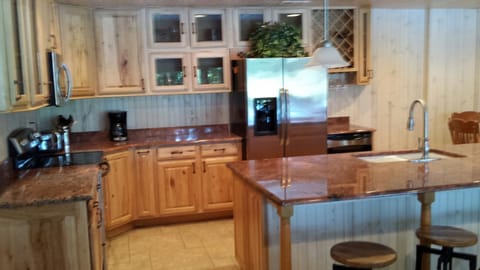 Kitchen with granite counter top and wine cooler fridge