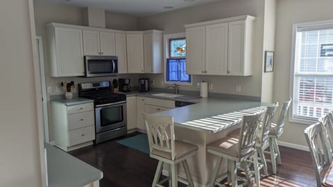 Large kitchen with prep area and seating